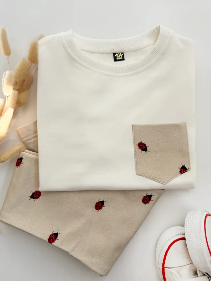 Komplet dla dziecka koszulka z kieszonką + legginsy biedronki na beżu