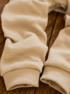 Legginsy niemowlęce prążkowane kremowe