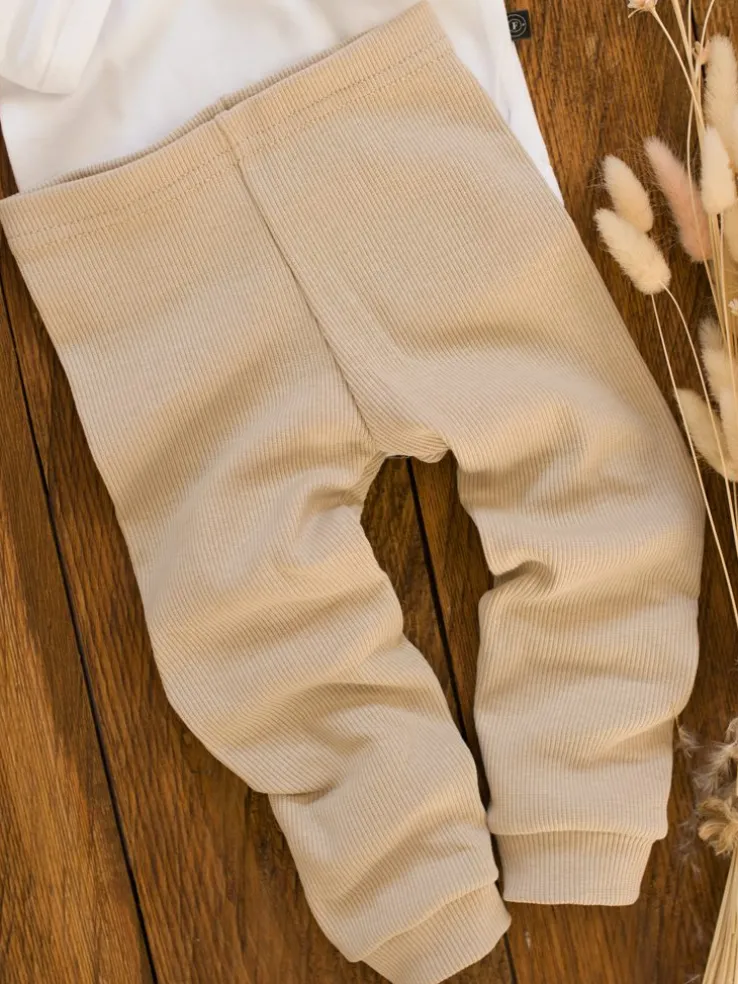 Legginsy niemowlęce prążkowane kremowe