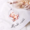 Okrycie kąpielowe ecru z nadrukiem małe cudo
