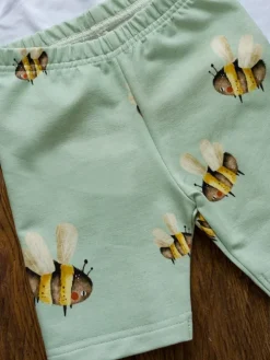 Spodnie kolarki dziewczęce w pszczółki na zieleni
