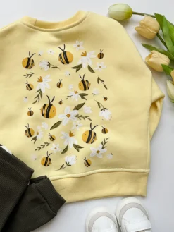 Żółta bluza dziecięca z nadrukiem pszczółek